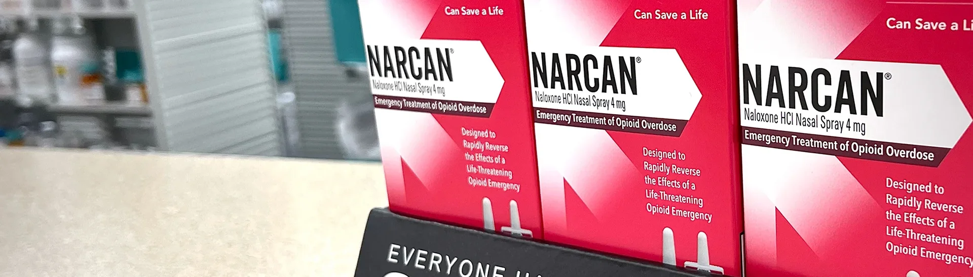 Display of NARCAN products on a pharmacy counter.