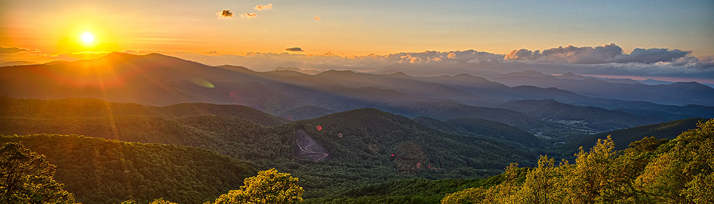 View of mountain peaks at sunset